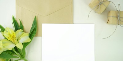 white paper beside green flower