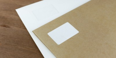 white printer paper on brown wooden table