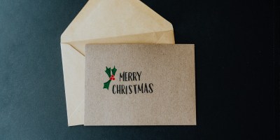 A white envelope with a merry christmas message on it